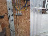 an image of a garage with a blue hose and a blue bucket