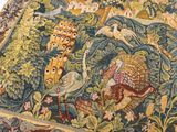 a picture of a tapestry with animals and birds on it