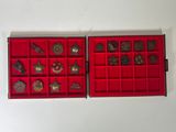 two red boxes with different types of metal items in them