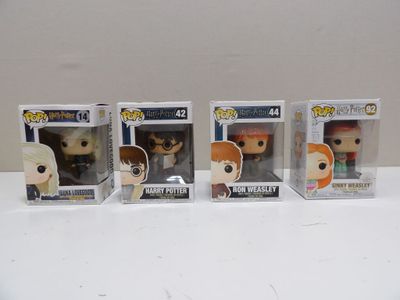 four pop vinyl figures of harry potter and hermion from harry potter and hermion and hermion from harry potter and hermion