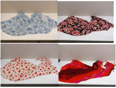several different types of scarves are displayed on a shelf