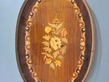 a picture of a wooden tray with a floral design on it