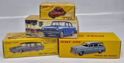 three boxed toy cars sitting on top of each other on a white surface