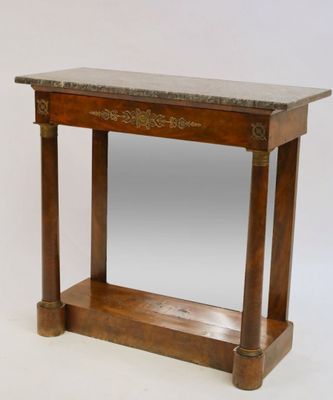 a small wooden table with a marble top on it