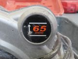 a close up of a motorcycle with a 65 mm sticker on it