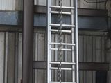 many ladders that are sitting in a building