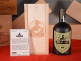 a bottle of wine sitting next to a wooden box
