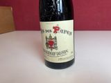 a bottle of wine that is sitting on a table