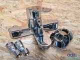 a close up of a faucet on a plywood floor