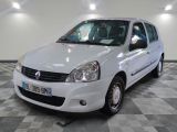 a picture of a small white car parked in a garage