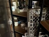 a metal rack that has a bunch of items on it