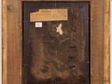 an old picture frame with a piece of paper taped to it