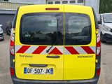 a yellow van that is parked in a parking lot