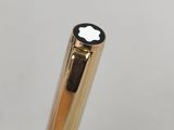 a gold pen with a black apple logo on it