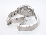 a watch that is laying on a white surface