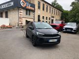 a black car parked in front of a building