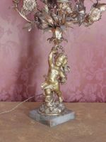 CANDELABRE en bronze ciselé et doré à décor d'un putti soute… (photo 2)
