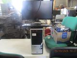 a desktop computer sitting on a desk in a room