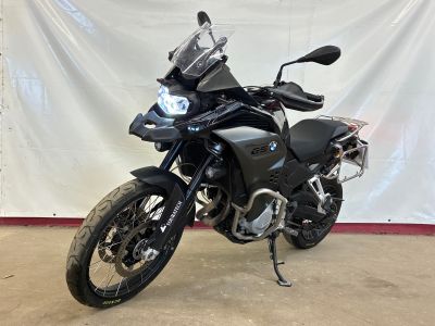 a picture of a black motorcycle parked in a garage