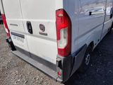 a white van that is parked in the parking lot