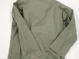 the back of a green jacket on a white background