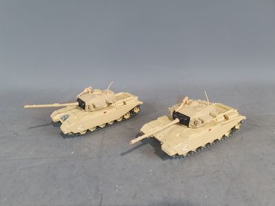 two toy tanks that are sitting next to each other