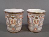 two cups sitting next to each other on a table