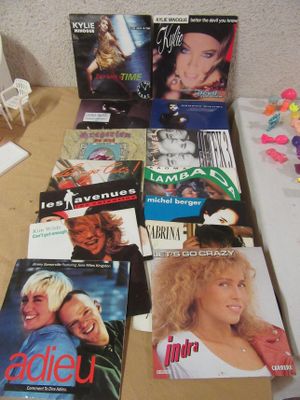 a lot of dvds on the table next to each other