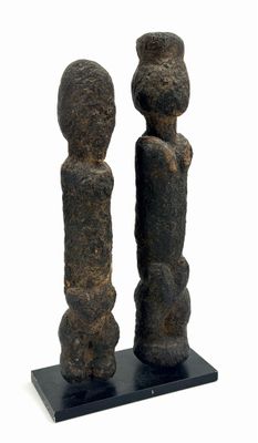 sculpture of two figures on a black base on a white background