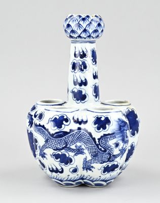 a blue and white vase with a dragon on it