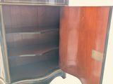 an image of a wooden cabinet with a door open