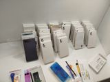 a lot of pens and notebooks sitting on a table