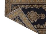 an image of a black rug with a gold medallion design on it