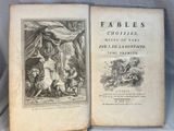 un vieux livre avec l'image d'un homme et d'une femme