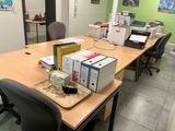 a wooden table with a bunch of boxes on it