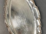 a close up of a silver plate on a table