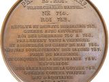 a plaque on the side of a building that has a plaque on it