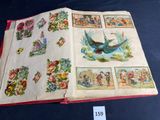 an open book with pictures of birds and flowers on it