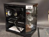 a computer case with a fan and a tablet on the table