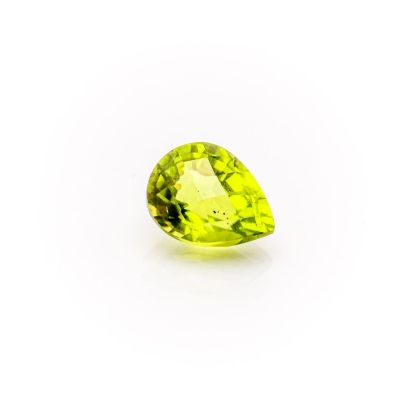 a pear shaped green peridot gems on a white background