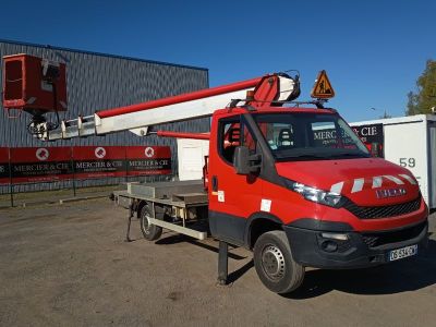 a red truck that is parked in front of a building