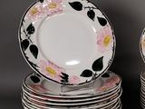 many plates stacked on top of each other on a table