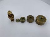 a close up of a table with a bunch of brass objects on it