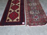 two rugs that are on the floor in a room
