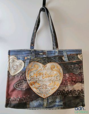a close up of a bag with a heart on it