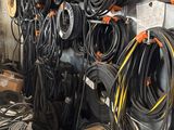 many different types of hoses and wires on the wall