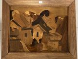 tableau représentant une femme et un chat, dans un cadre en bois accroché au mur