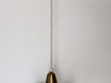 a small metal object hanging from the ceiling