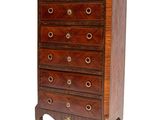 an image of a tall chest of drawers on a white background