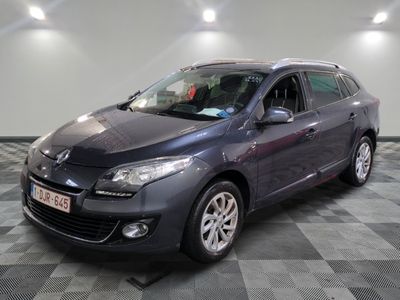 the grey car is parked on a checkered tile floor